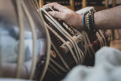 Close-up of hands playing piano