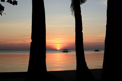 Scenic view of sea against orange sky