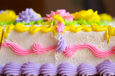 Close-up of multi colored cake on table