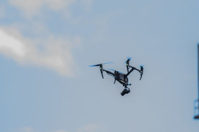 Low angle view of airplane flying in sky