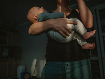 Midsection of woman with arms crossed