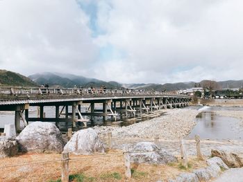 Bridge over river against sky