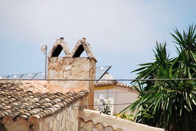 Built structure on roof of building against sky