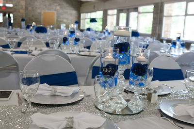 Glass of bottles on table in restaurant