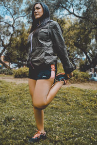 Full length of young woman standing on land