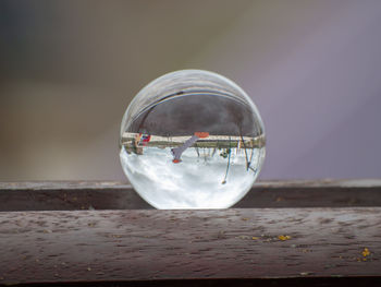 Close-up of crystal ball on glass of water