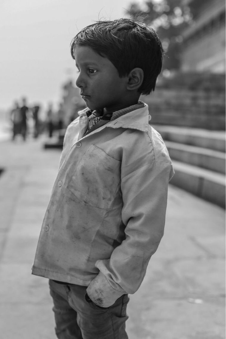 FULL LENGTH OF BOY STANDING ON FIELD