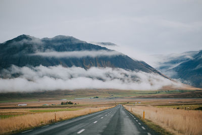 Road amidst landscape against sky