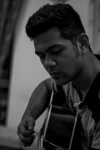 A boy practicing guitar