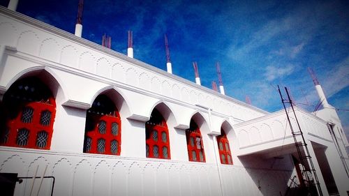 Low angle view of red cathedral against sky