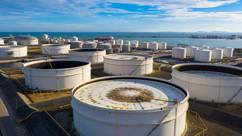 High angle view of container by sea against sky