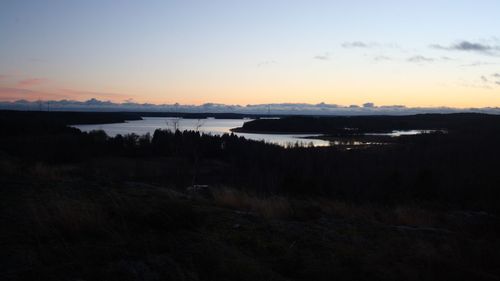 Scenic view of lake against sky during sunset