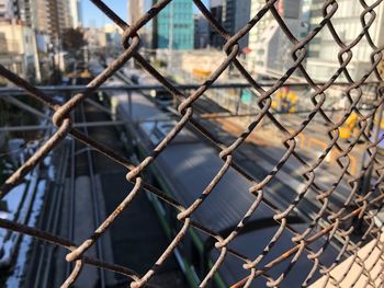 Full frame shot of chainlink fence against sky