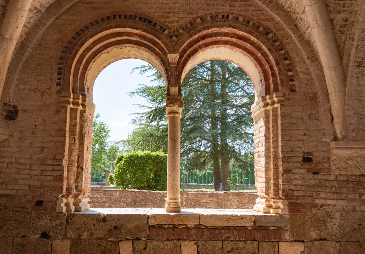 LOW ANGLE VIEW OF HISTORICAL BUILDING SEEN THROUGH WINDOW