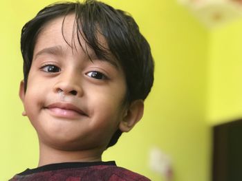 Portrait of smiling boy at home