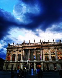 Low angle view of historical building against cloudy sky