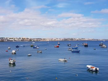 High angle view of sailboats in sea against sky