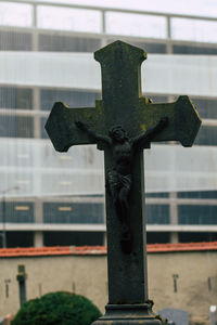 Close-up of cross sculpture