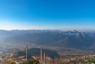 High angle view of mountains against blue sky