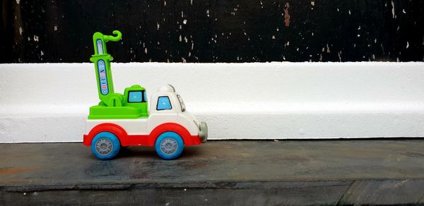 Toy car on wall
