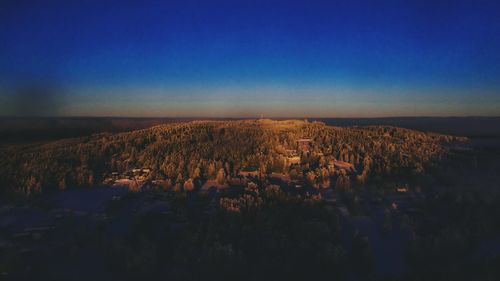 Panoramic view of landscape against blue sky