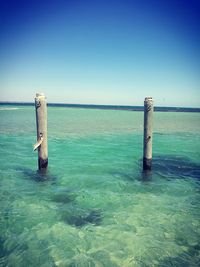 Scenic view of sea against clear blue sky