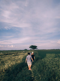 Full length of man on field against sky