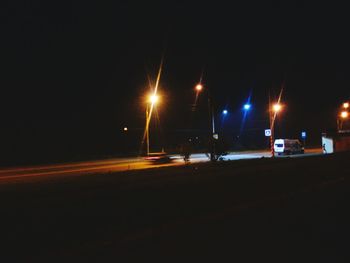 Illuminated street lights at night