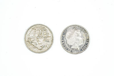 Close-up of coins against white background