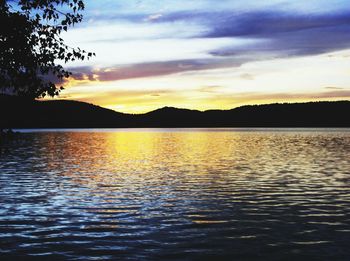 Scenic view of lake at sunset