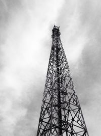 Low angle view of communications tower against sky