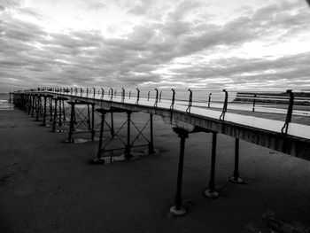 Pier on sea against sky