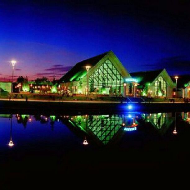 illuminated, night, architecture, built structure, water, reflection, building exterior, lighting equipment, sky, blue, river, street light, waterfront, bridge - man made structure, connection, city, light - natural phenomenon, outdoors, no people, dusk