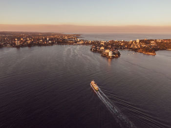 Drone view of manly, sydney, new south wales, australia. ferry from circular quay arriving at manly.