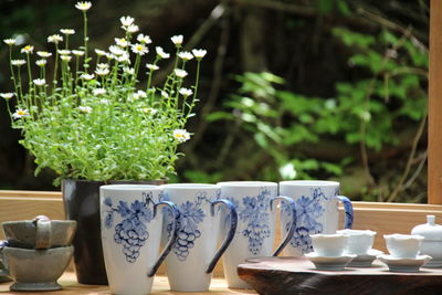 Close-up of mugs on table