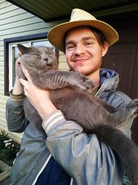 Portrait of smiling young man wearing hat