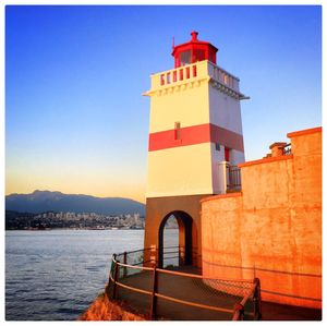 Lighthouse against clear blue sky