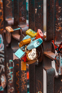 Close-up of padlocks hanging on railing