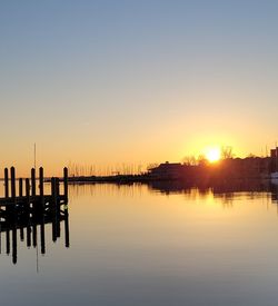 Scenic view of lake against sky during sunset