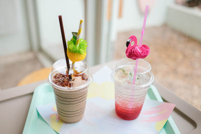 Close up of milk tea and strawberry soda on the table, drinks at cafe.