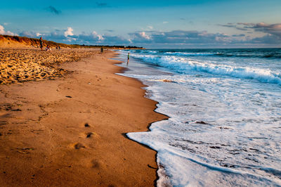 Scenic view of beach against sky