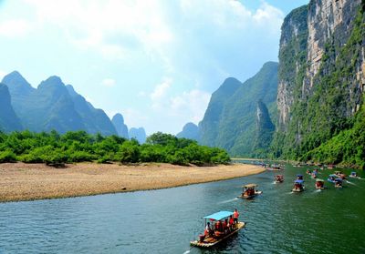 Panoramic view of people on river