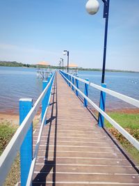 Pier over sea against sky