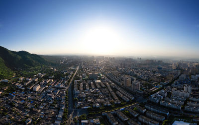 High angle view of city buildings against clear sky