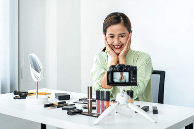 Portrait of young woman working in office