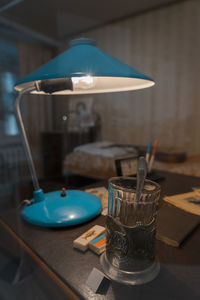 Close-up of wine glasses on table