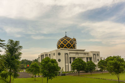 View of building against cloudy sky