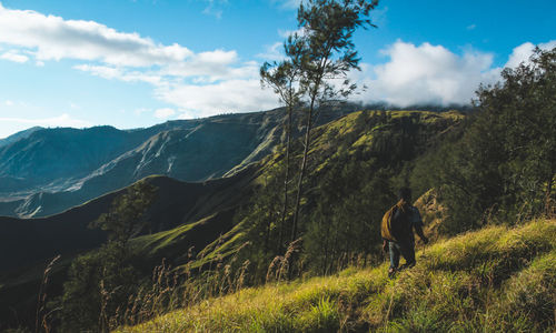 Man taking a hike of tambora mountain hiking trail