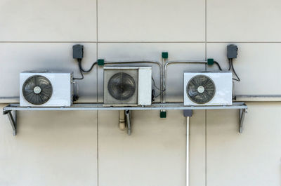 Air conditioners on building wall