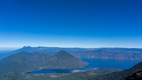 Scenic view of mountains against clear blue sky